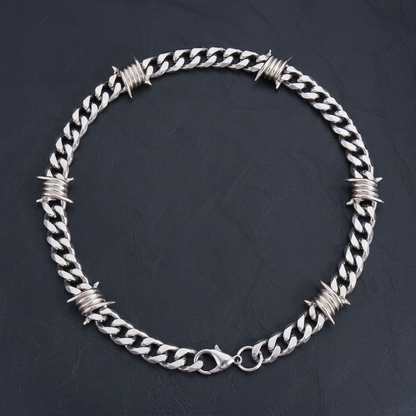9mm Snare Chain laid flat on dark ground, lobster clasp detail
